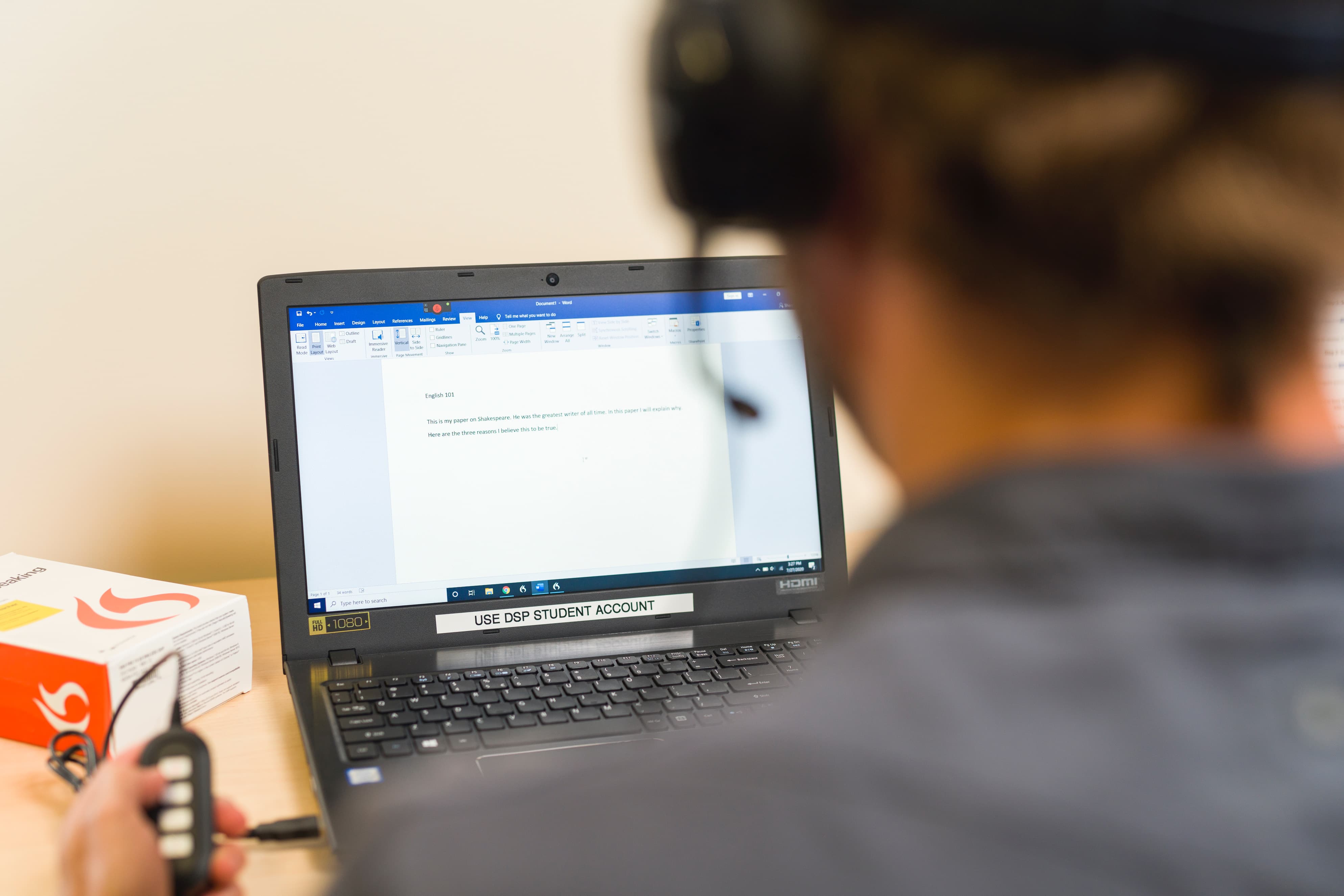 Student using Dragon on a laptop